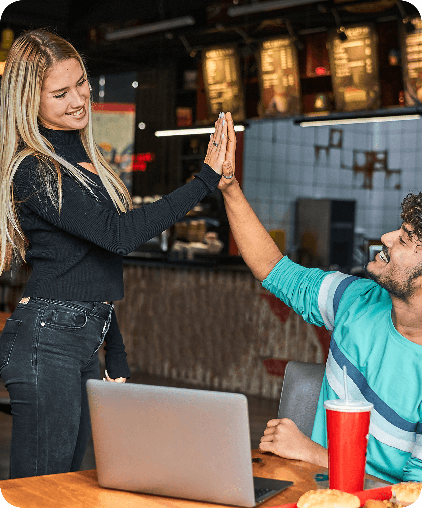 Two Crispo’s team members sharing a high five